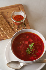 Vegan red soup in white plate