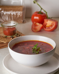 Vegan red soup in white plate