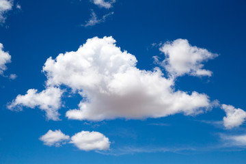 Naklejka na ściany i meble A beautiful blue sky with a big white cloud