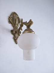 A Retro Gold Lamp on A Wall