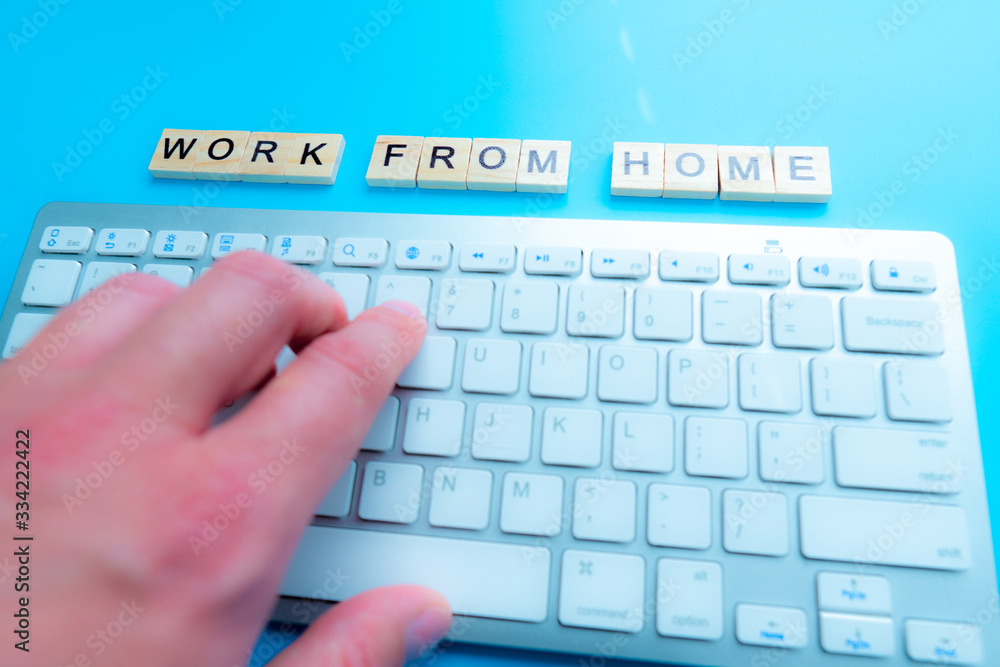 Poster concept work from home 'work from home' written post it on laptop keyboard