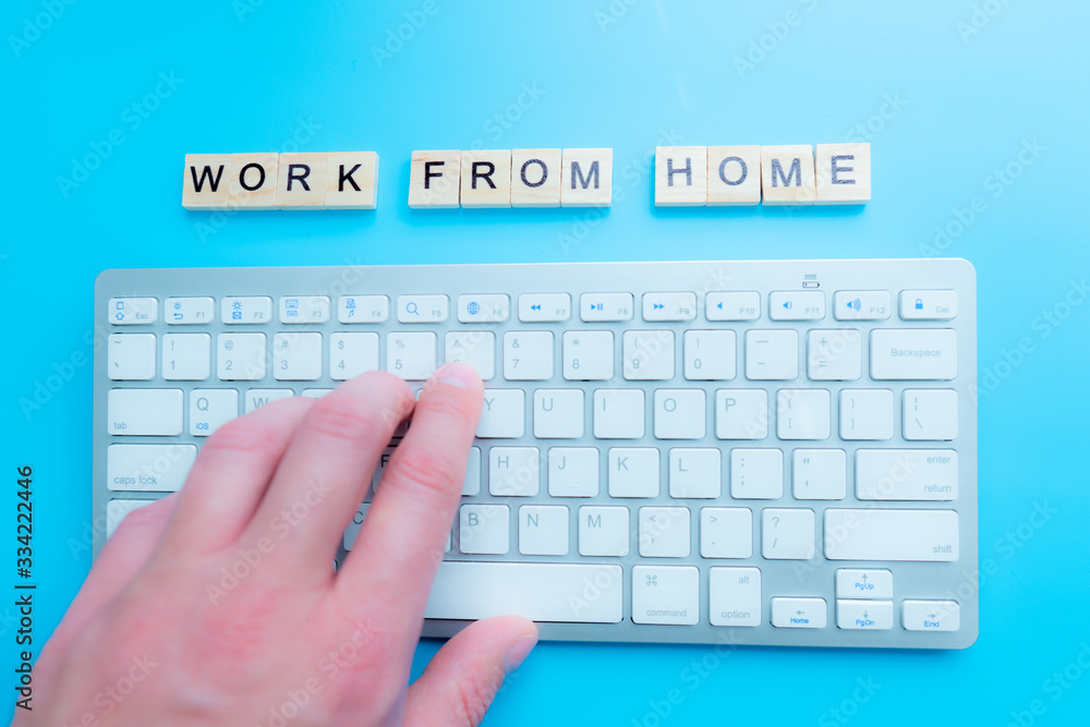 Poster concept work from home 'work from home' written post it on laptop keyboard