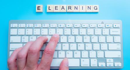 e-Learning and online education concept with text - E-learning r key on a white computer keyboard...