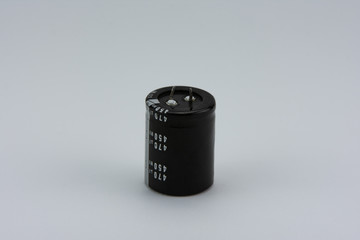 Electrolytic capacitor isolated on white background.