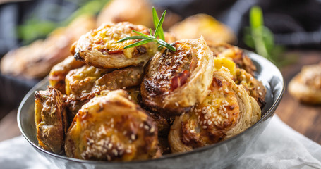 Pizza rolls stuffed with various ingredients, prosciutto bacon spinach basil mozzarella or parmesan cheese