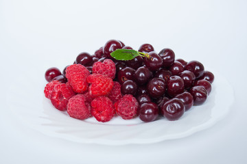 berries in a bowl isolated on white
