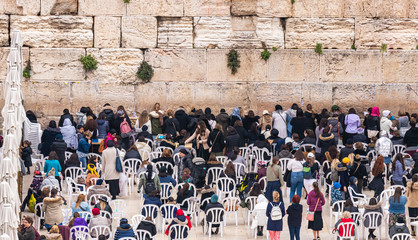 Jewish women believers pray in the female half near the Western Wall in the Old Town of Jerusalem in Israel