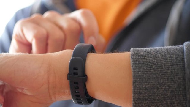 Man checking His Fitness Tracker, Close Up