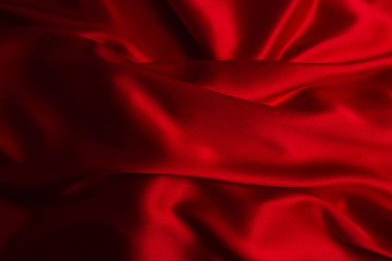 Red silk or satin luxury fabric texture can use as abstract background.