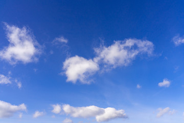 saturated blue sky with small pile clouds