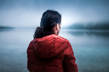 Fototapeta premium Young woman on the foggy beach
