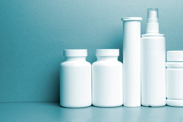 photo of five plastic cans for package pills and vitamins and antiseptic spray for protection...