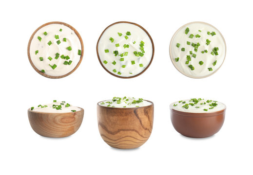 Set of delicious sour cream with onion in bowls on white background