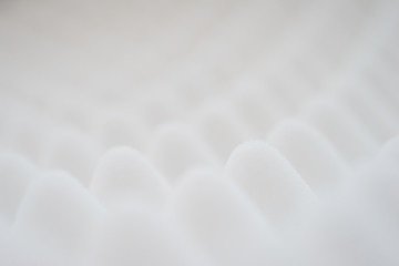 White gradient abstract background with many waves at different angles.