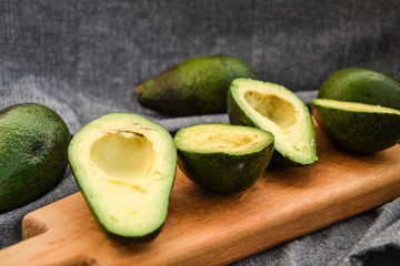 Halves fresh avocado, Ripe avocado and cut avocado with bone.