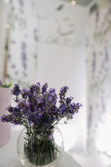 bouquet of flowers in glass vase on white background