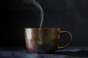 thread of smoke on a bronze cup