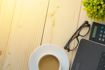 home working concept. office supplies on wooden office desk. flat lay. copy space for your text. selective focus