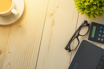 home working concept. office supplies on wooden office desk. flat lay. copy space for your text. selective focus