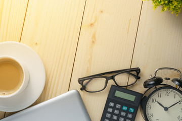 home working concept. office supplies on wooden office desk. flat lay. copy space for your text. selective focus
