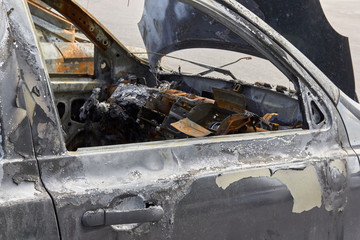 the salon burned-out car in one of the city's districts