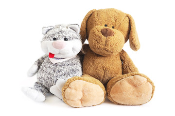 soft toys cat and dog are sitting in an embrace. isolate on a white background..