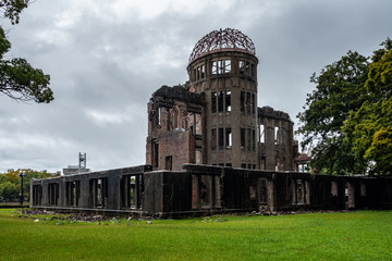 View of A-Bomb Dome or Genbaku Dome at Hiroshima Peace Memorial Park. It was one of the few buildings to remain standing when the bomb exploded.
