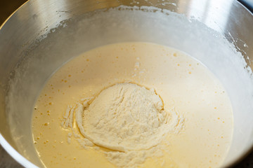 Beating cream for a sweet dessert in a food processor. Cream nozzle