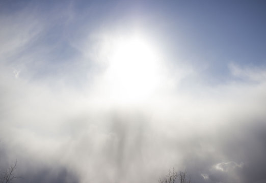 cloudy sun with a crawling snow cloud on sky. element of nature. milk light