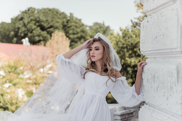 Beauty fashion portrait of bride on nature background. Beautiful modern bride.