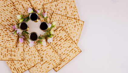 Background of four wine cups with matzah. Jewish holidays Passover.