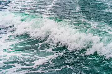 Seething atlantic sea water with foam, jet, stream Cape Cod
