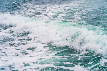 Seething atlantic sea water with foam, jet, stream Cape Cod