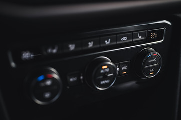 Color detail with the air conditioning button inside a car. Car interior. Car air condition.
