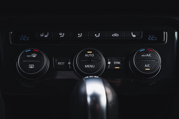 Color detail with the air conditioning button inside a car. Car interior. Car air condition.