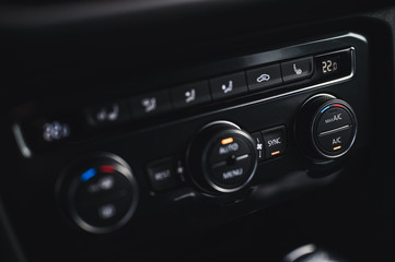 Color detail with the air conditioning button inside a car. Car interior. Car air condition.