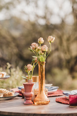 bouquet of flowers in a vase on wooden table