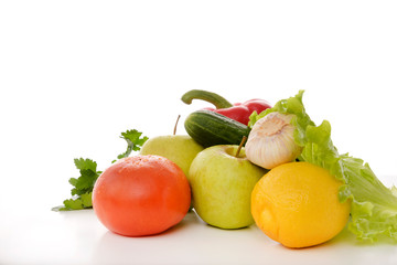 fresh vegetables, fruits and greens on a white background, tomato, lemon, lettuce, cucumber, garlic, pepper, Apple,
