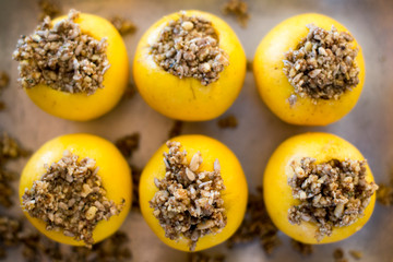 Baked yellow apples stuffed and ready to bake