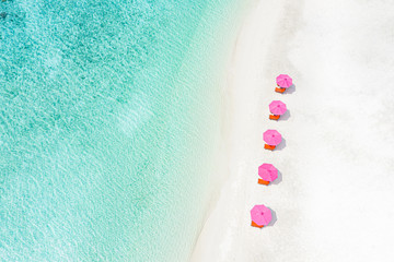 Aerial view of tropical beach nature as summer landscape with lounge chairs umbrella and calm sea for beach banner. Luxurious travel landscape, beautiful destination for vacation holiday. Summer beach