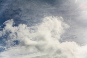 Obraz premium Large cotoneous clouds in a blue sky