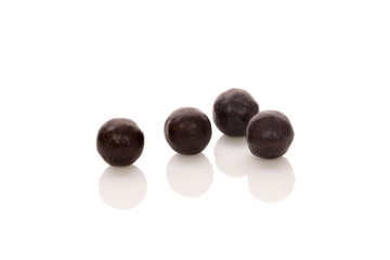 Traditional chinese natural herbal pills isolated on white.