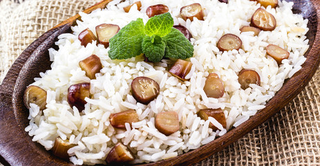 rice with pine nuts, typical Brazilian food during the winter. Meal made with pinaceaes and araucariaceaes, served hot. IN Brazil it is called "pinhaõ" rice