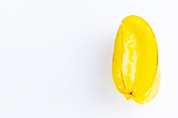 Carambola on the white background. Star Fruit (Averrhoa carambola L.) with copy space. Yellow fruit carambola. Top view