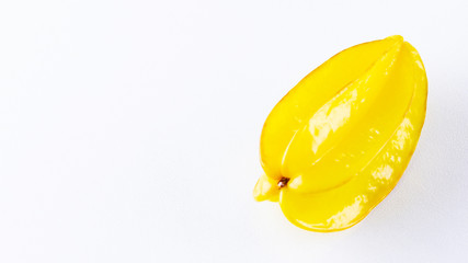 Carambola on the white background. Star Fruit (Averrhoa carambola L.) with copy space. Yellow fruit carambola. Top view