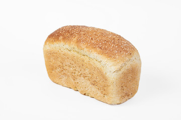 Bakery product. Fresh white molded bread with sesame seeds isolated on white background. Top view and copy space for text.