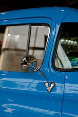 Chrome rearview mirror of an old American pickup truck