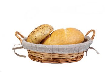 Bakery product. Bread. Beautiful composition with wicker basket and different bread on a white background. Isolate. Top view and copy space for text.