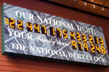 Running tally of US national debt sign