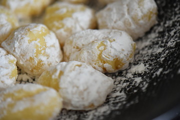 Italian gnocchi on black background 